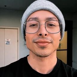 René Velarde in a gray beanie and glasses